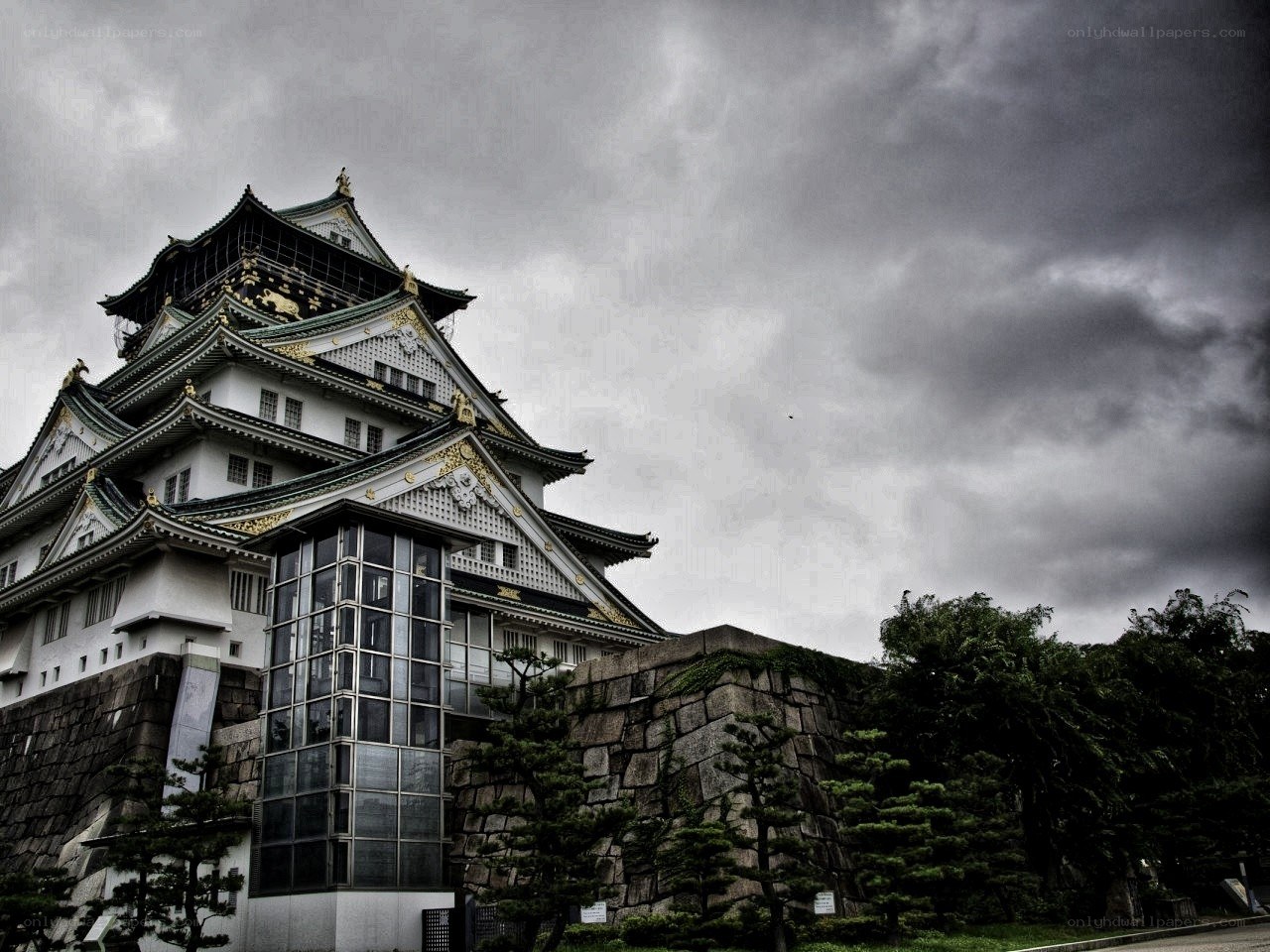 Osaka Castle under stormy sky
