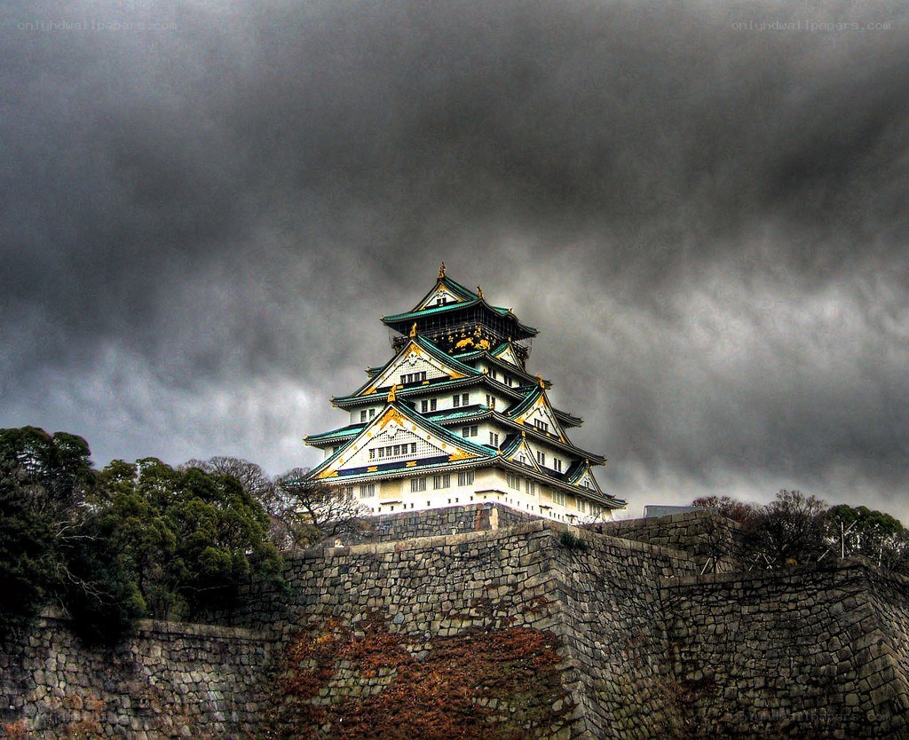 Osaka Castle under stormy sky