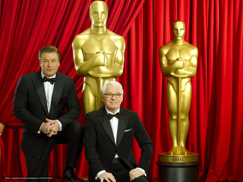 Oscar hosts with statues