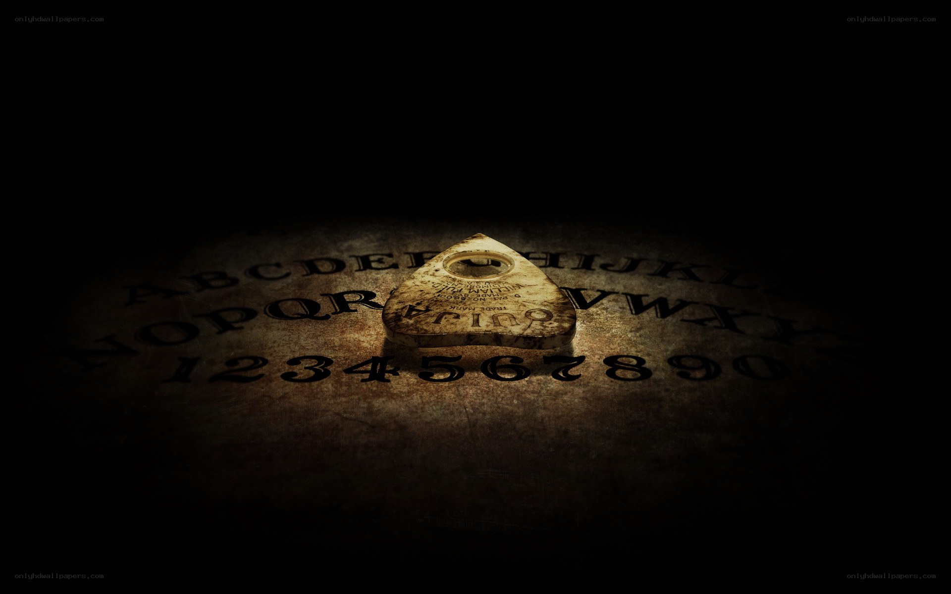 Ouija board in dark light