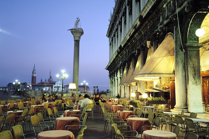 Outdoor cafe in Venice at dusk
