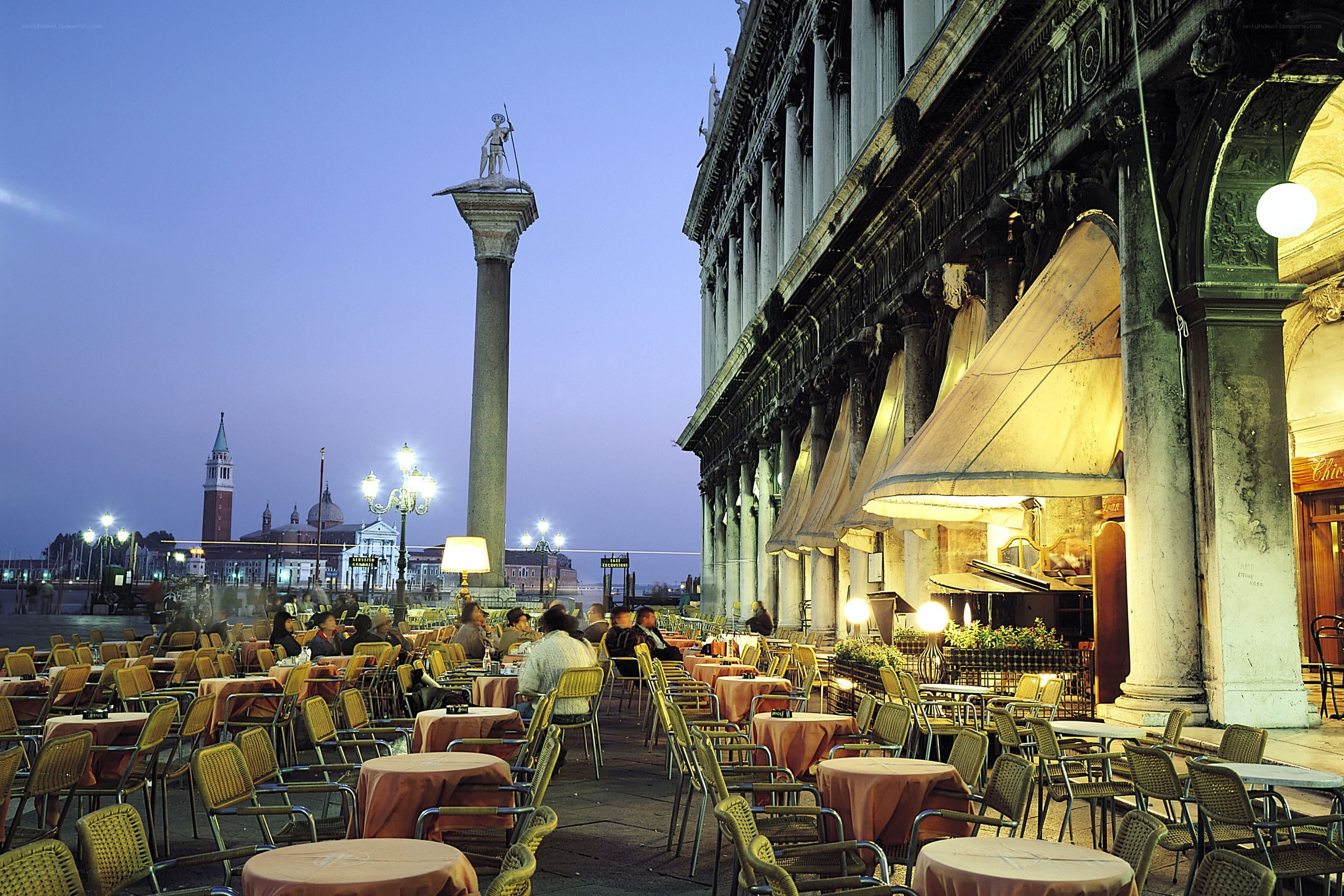 Outdoor cafe in Venice at dusk