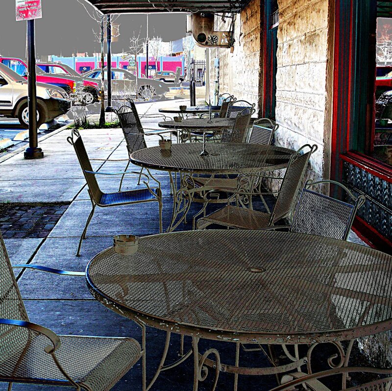 Outdoor cafe tables on a city sidewalk