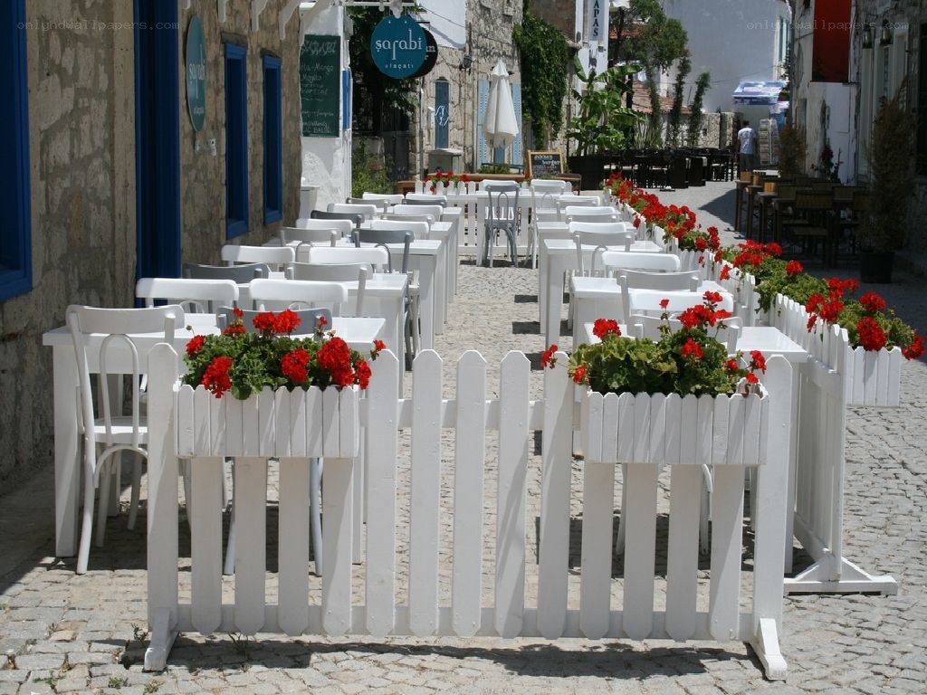 Outdoor cafe with white tables