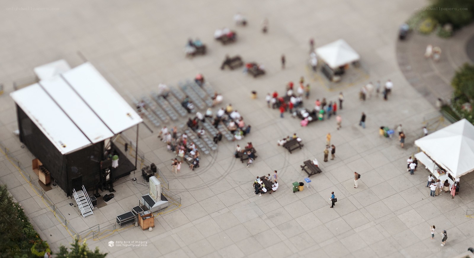 Outdoor event with stage and crowd