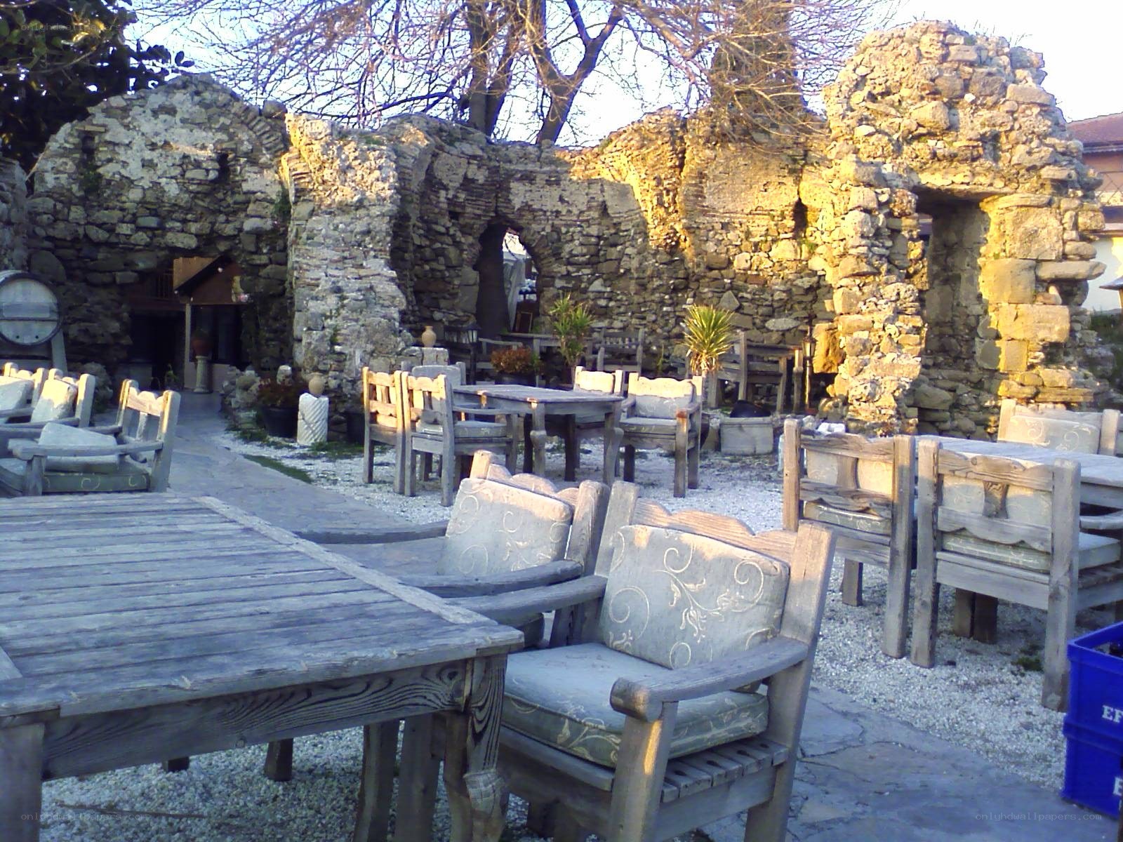 Outdoor seating at stone ruins