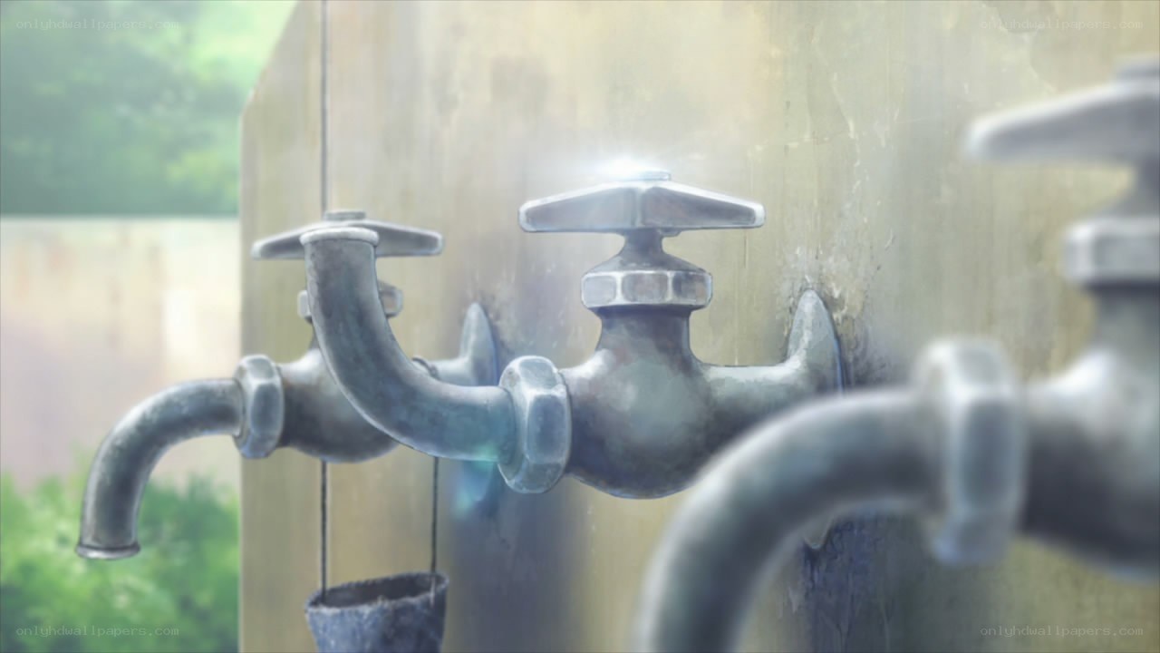 Outdoor water taps on a wall