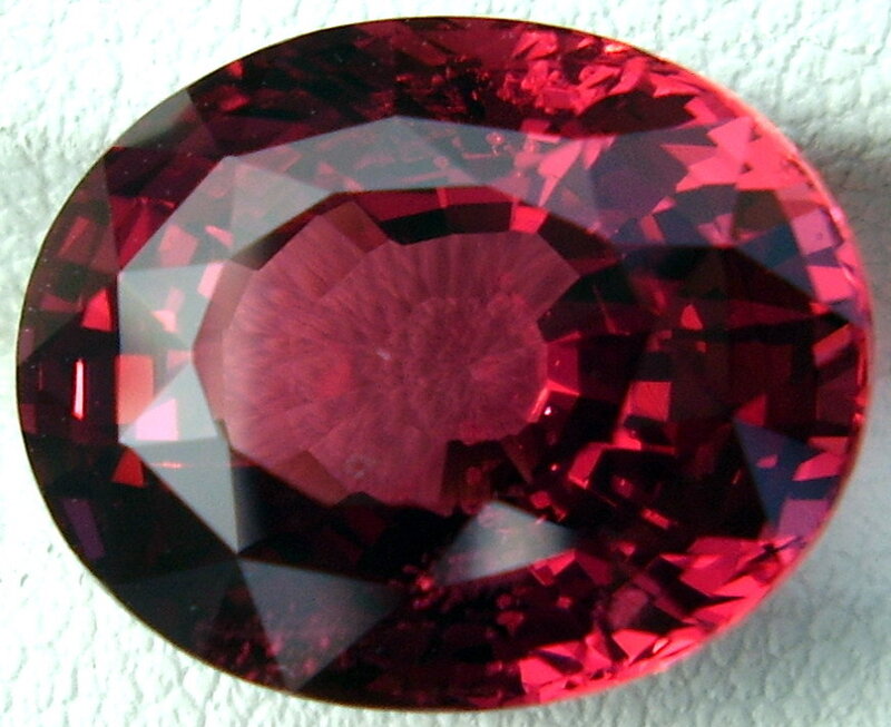 oval-cut red gemstone