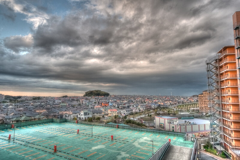 Overcast cityscape with parking lot