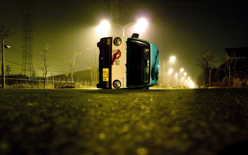 Overturned car at night