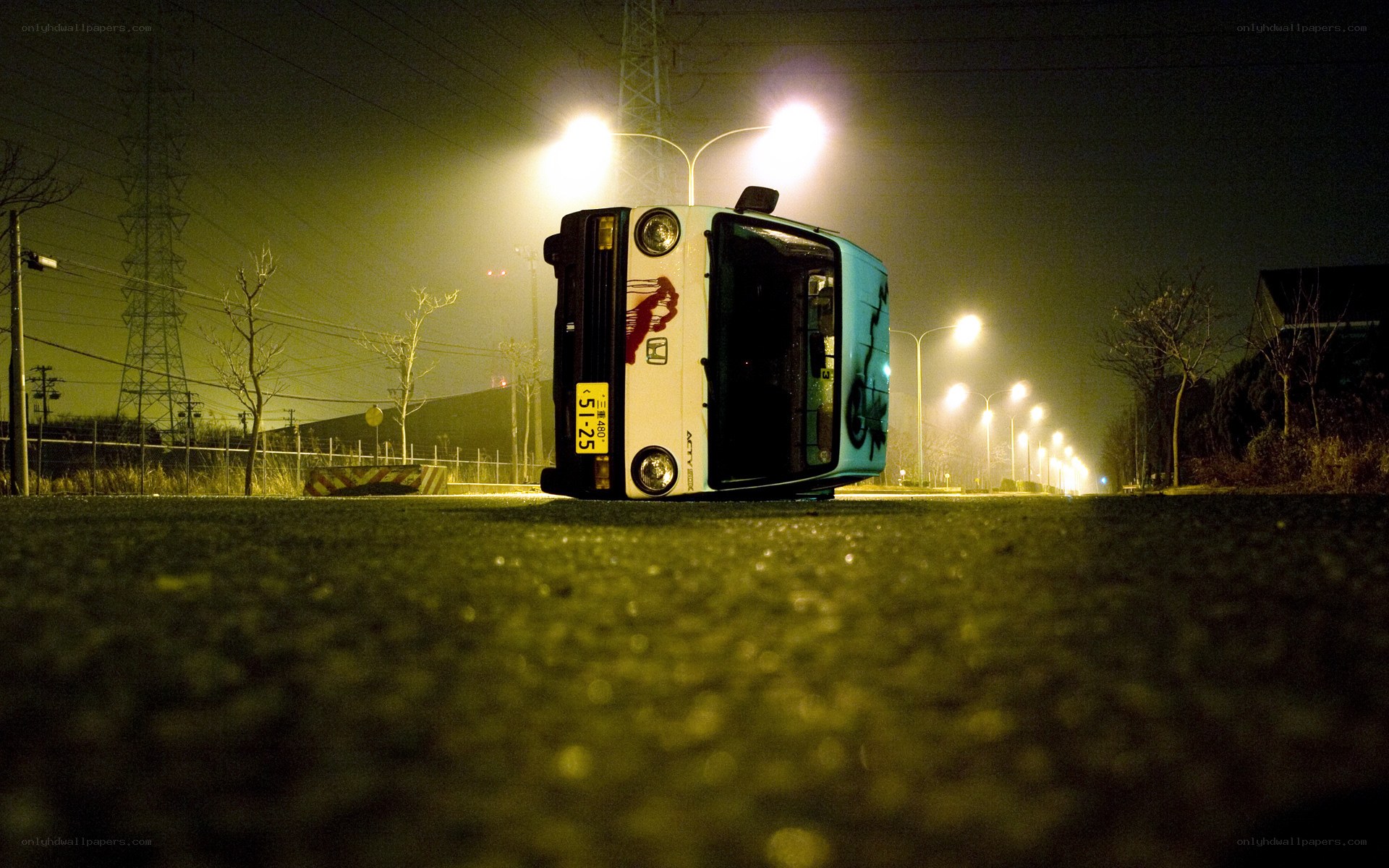Overturned car at night