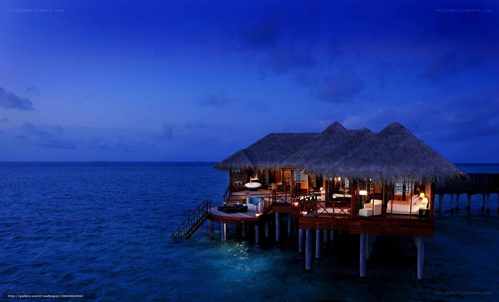 Overwater bungalow at dusk