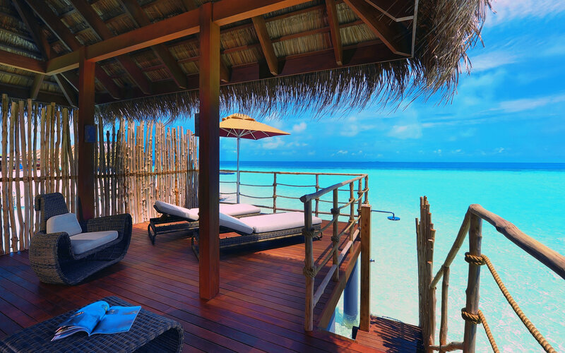 Overwater Bungalow Deck — Blue, Serene, Afternoon, Photograph, Lounge Chairs, Umbrella