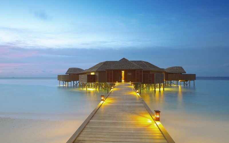 Overwater bungalows at dusk