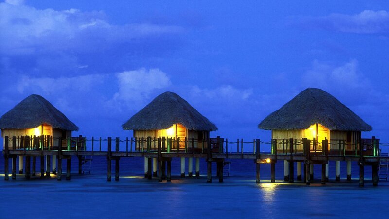 Overwater bungalows at dusk