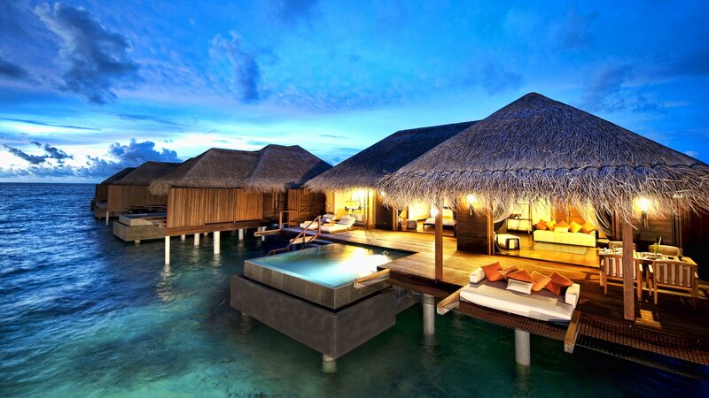 Overwater bungalows at dusk