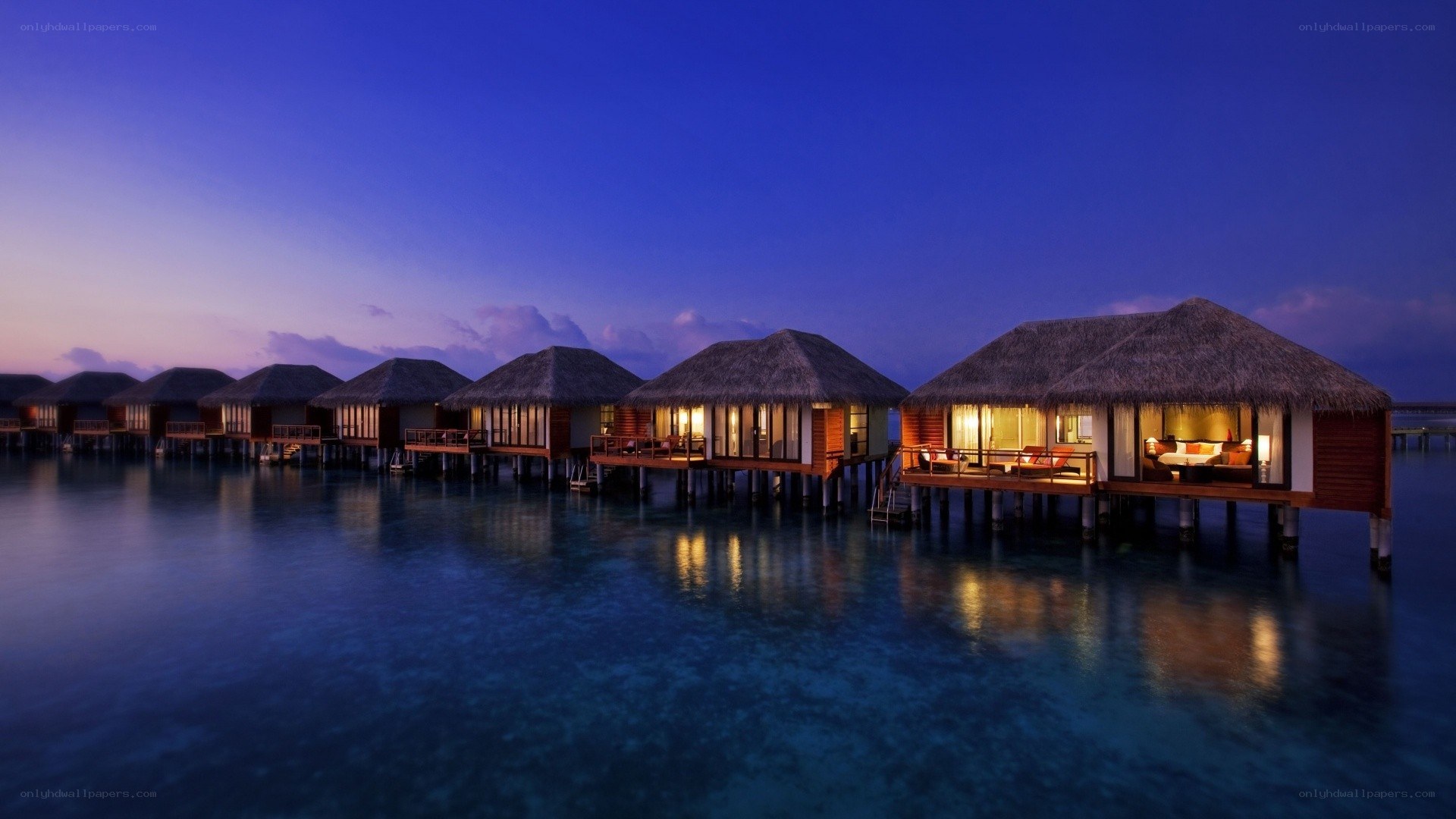 Overwater bungalows at dusk