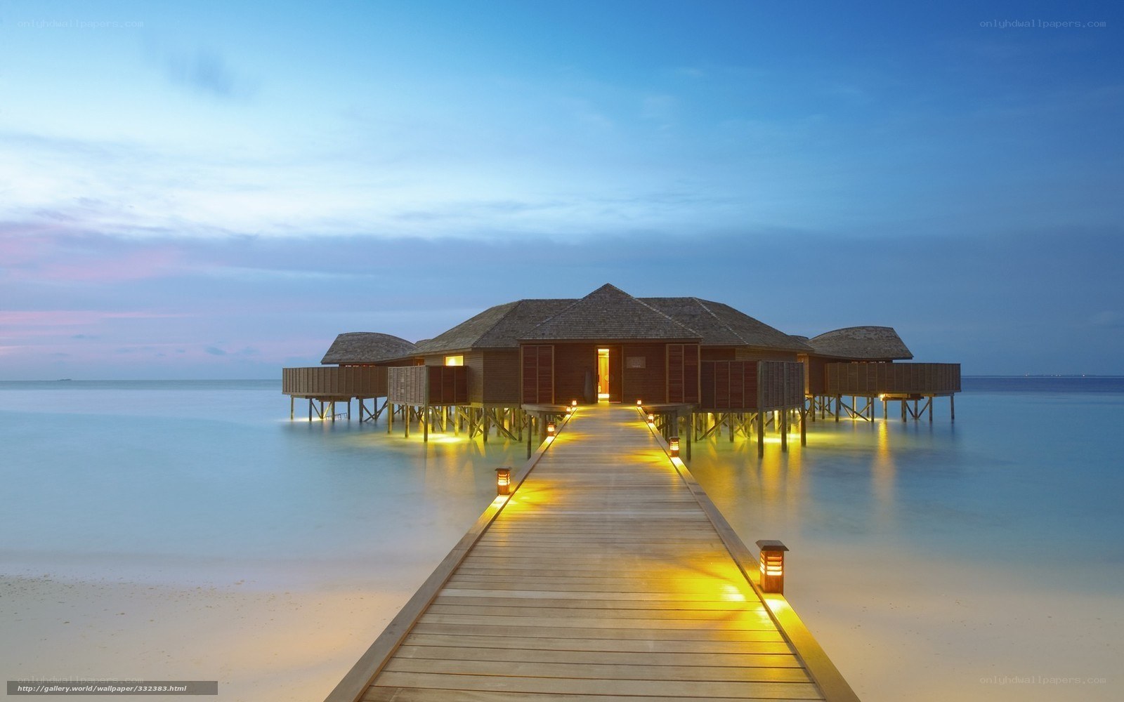 Overwater bungalows at dusk