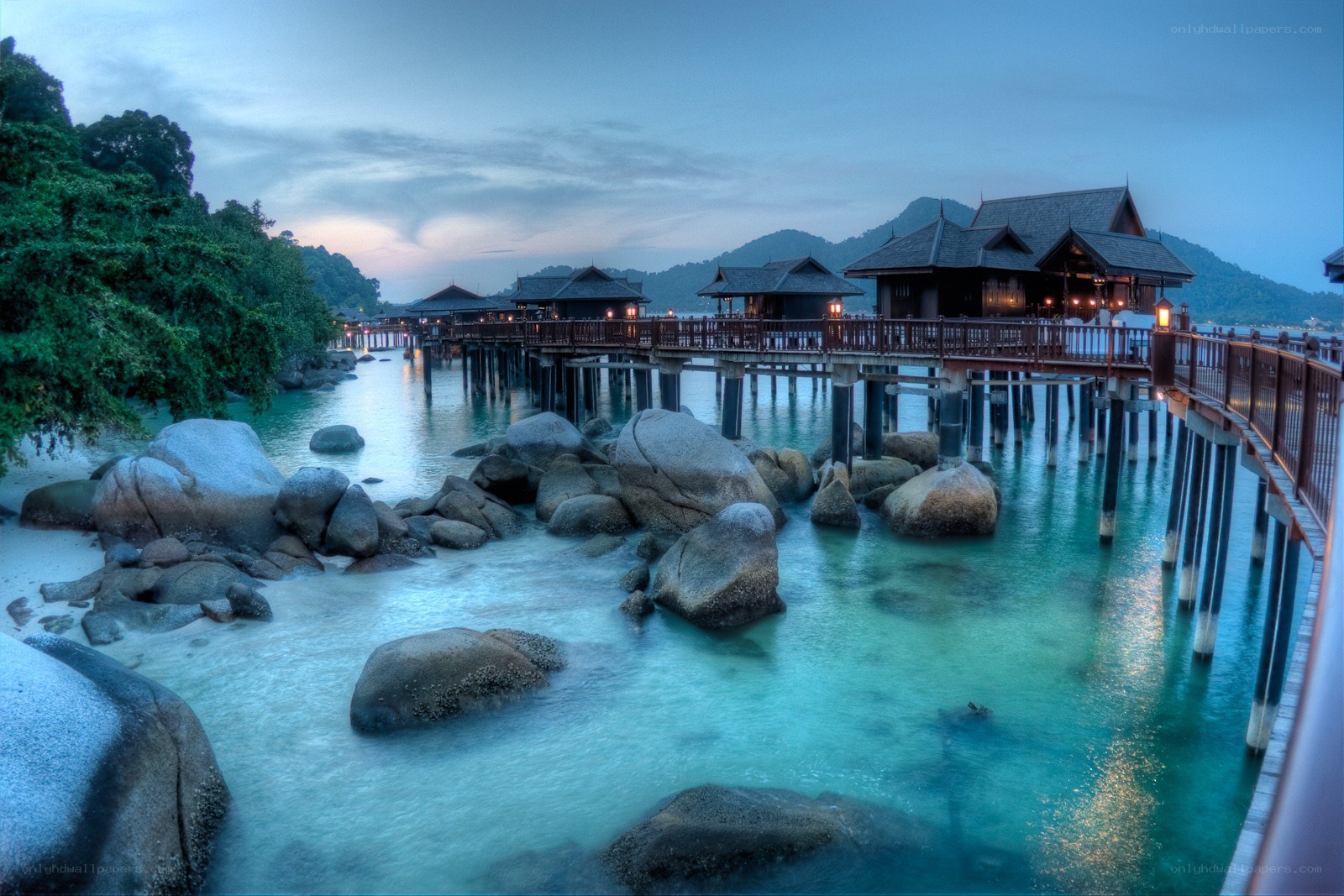 Overwater bungalows at dusk