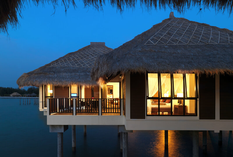 Overwater bungalows at dusk