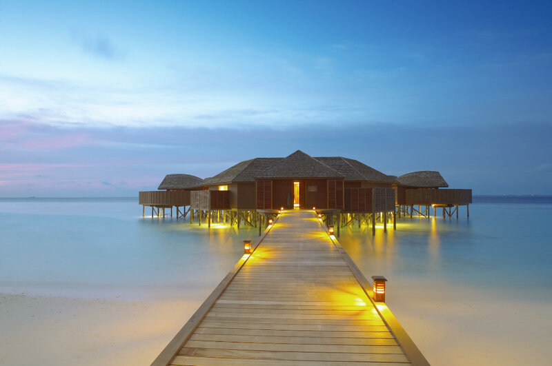 Overwater bungalows at dusk