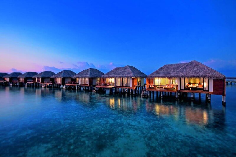 Overwater bungalows at dusk