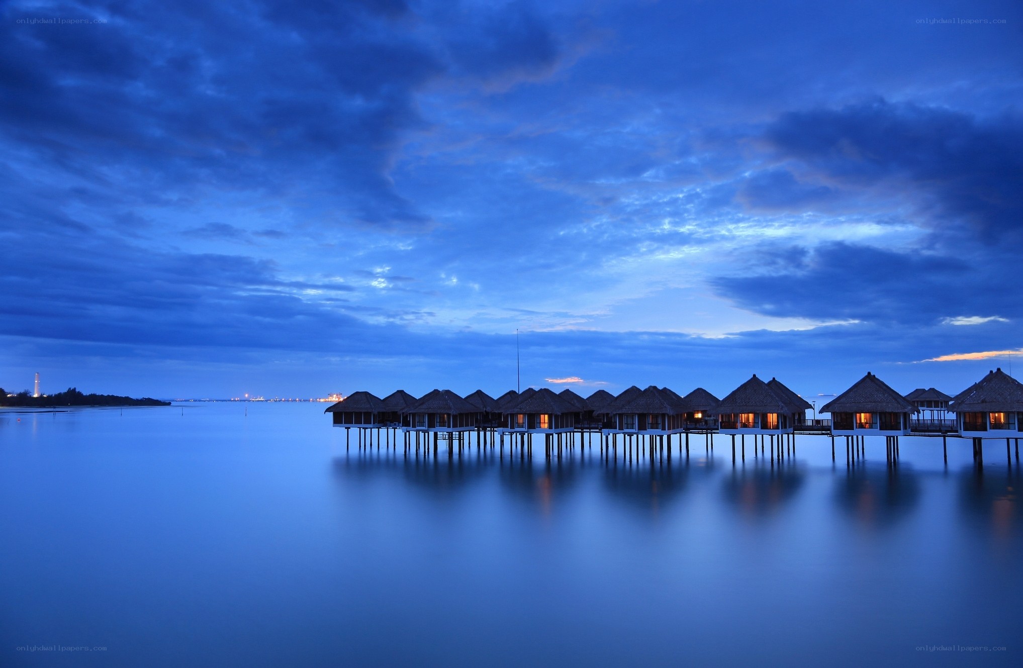 Overwater bungalows at dusk