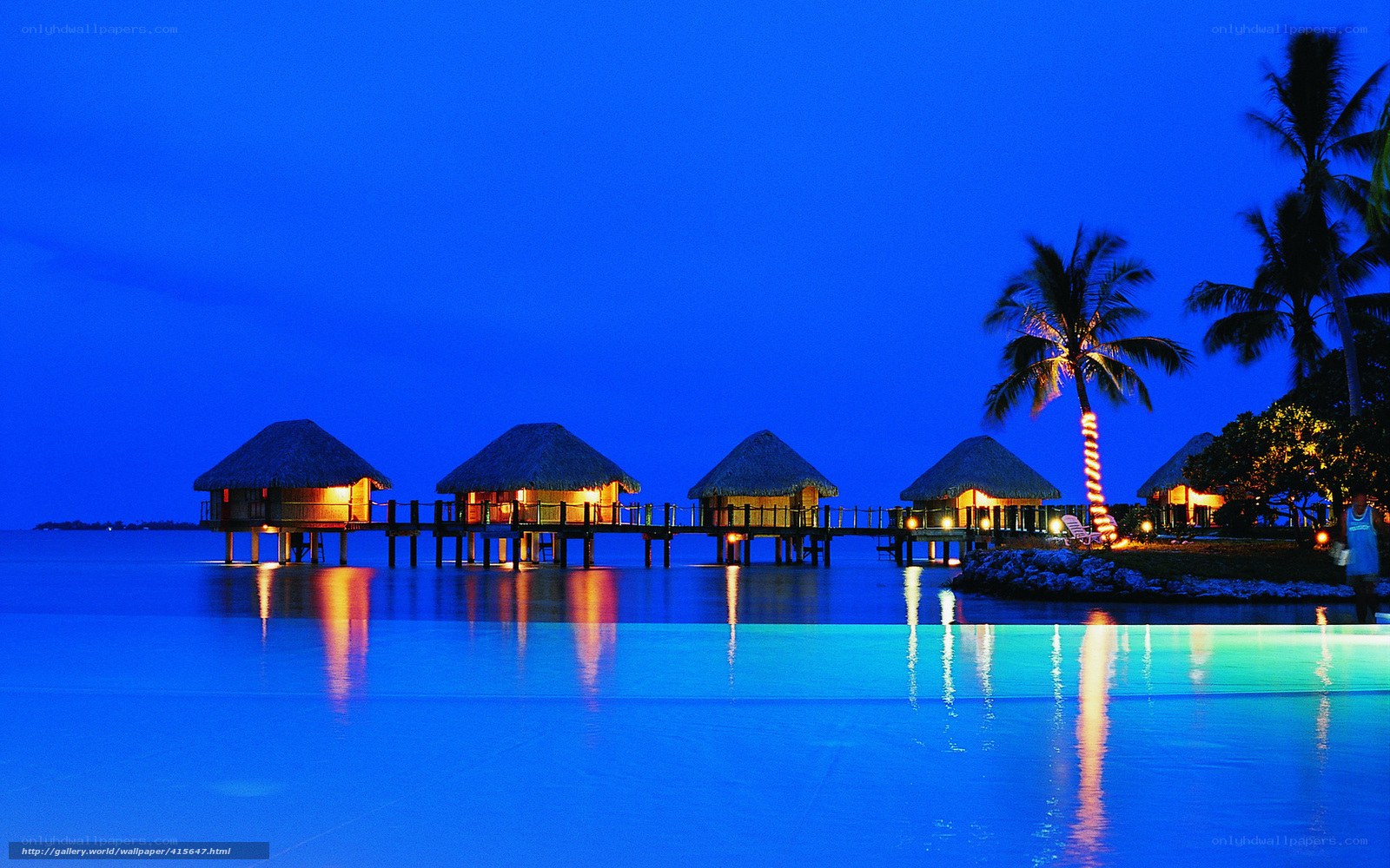 Overwater bungalows at dusk