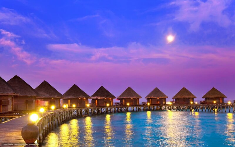 Overwater bungalows at dusk