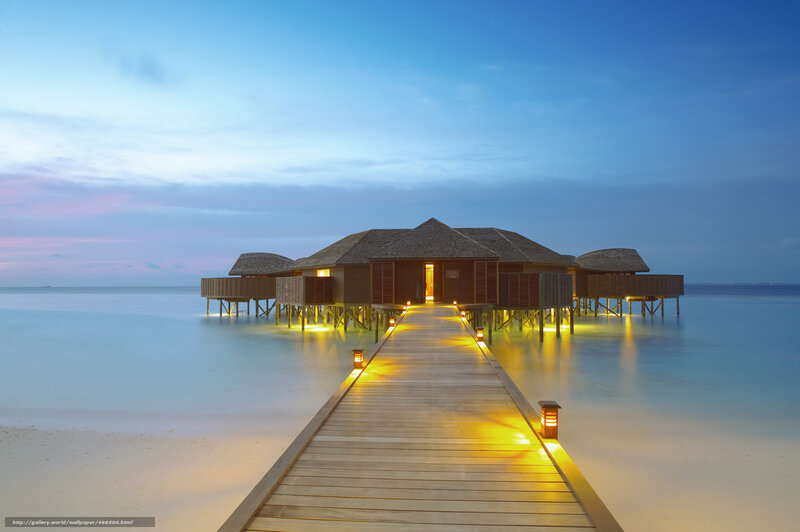 Overwater bungalows at dusk