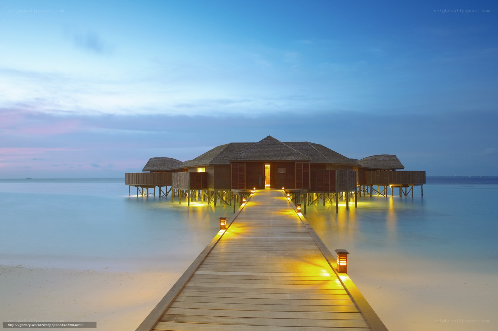 Overwater bungalows at dusk