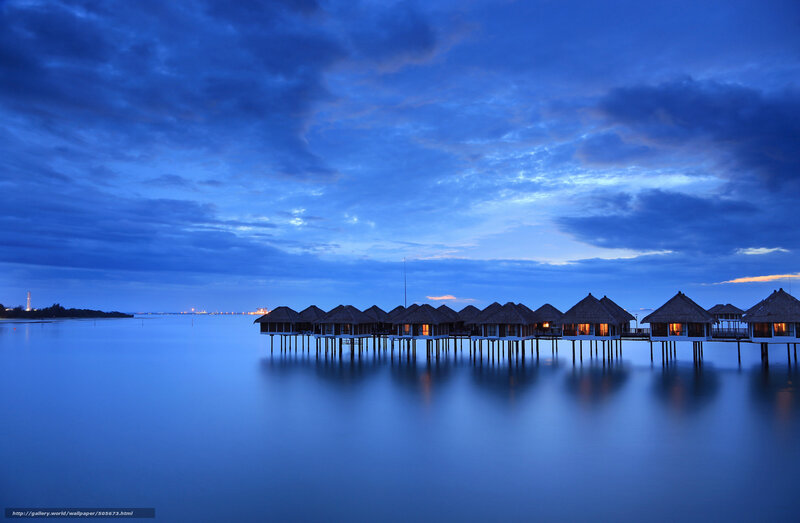 Overwater bungalows at dusk