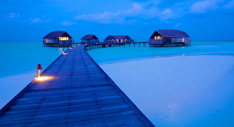 Overwater Bungalows at Dusk — Blue, Serene, Night, Photograph, Pier