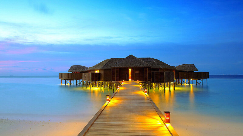 Overwater Bungalows at Dusk — Blue, Serene, Sunset