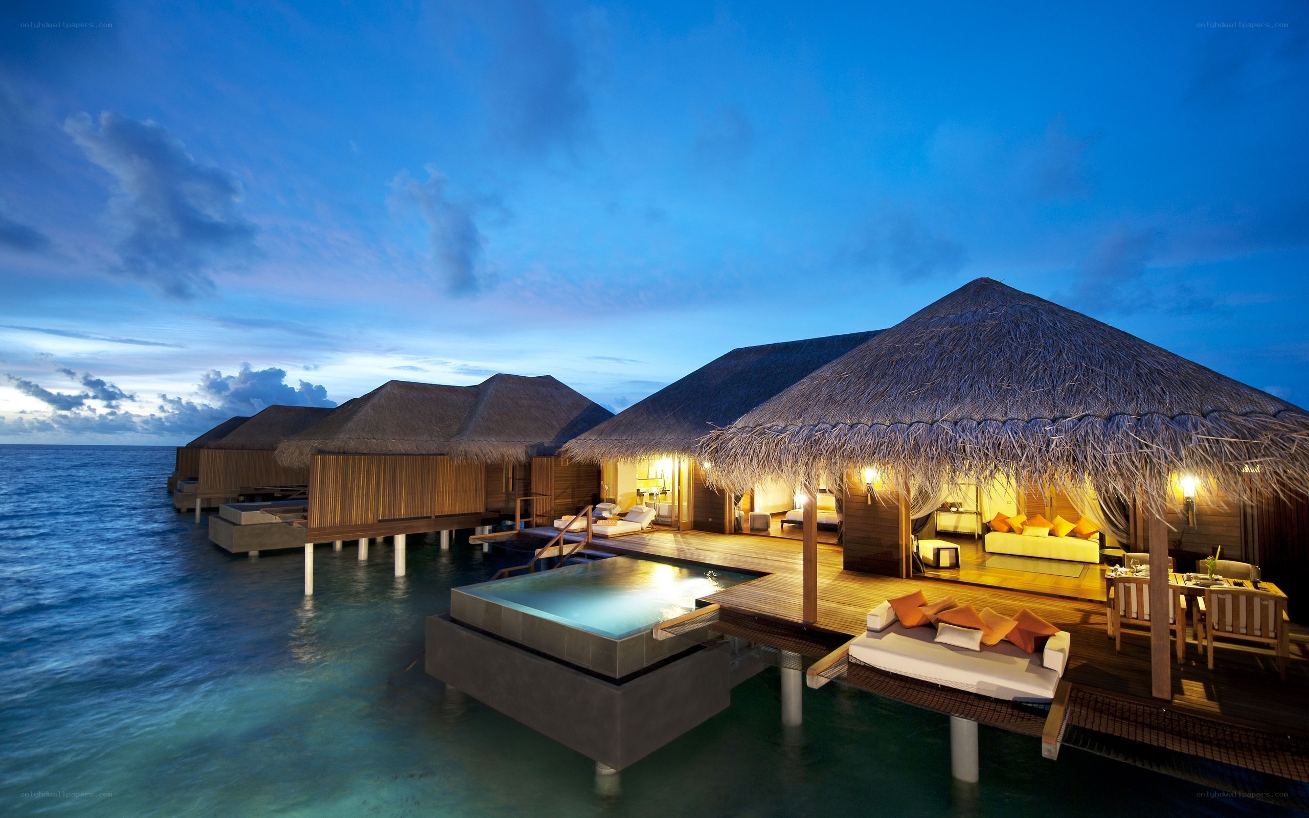 Overwater bungalows at dusk