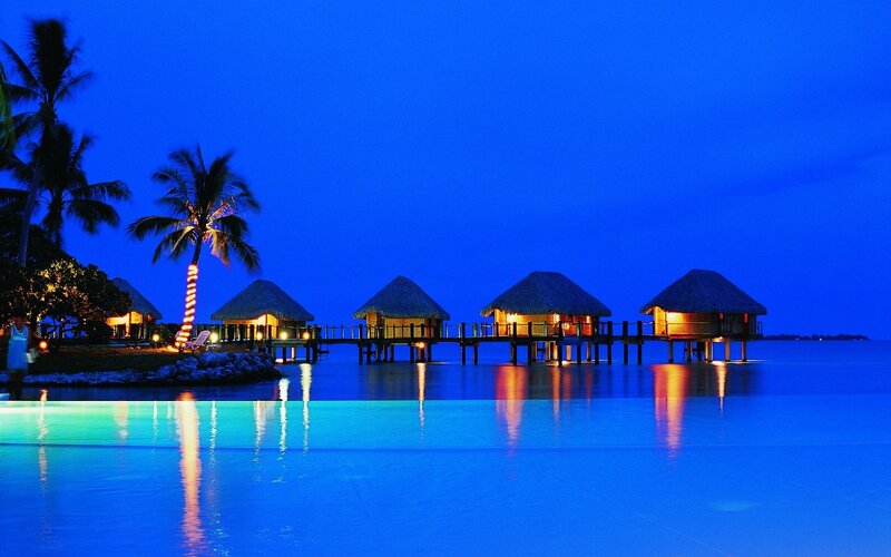 Overwater Bungalows at Night — Blue, Serene, Photograph, Palm Trees, Pool, Ocean