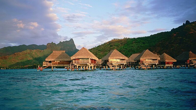 Overwater bungalows at sunset