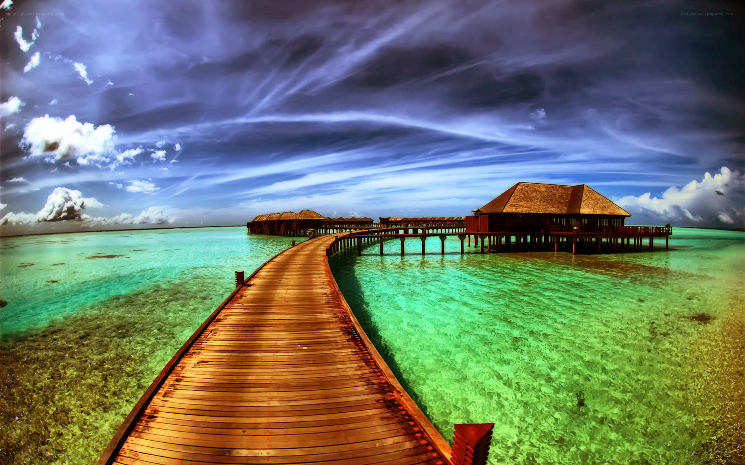 Overwater bungalows at sunset