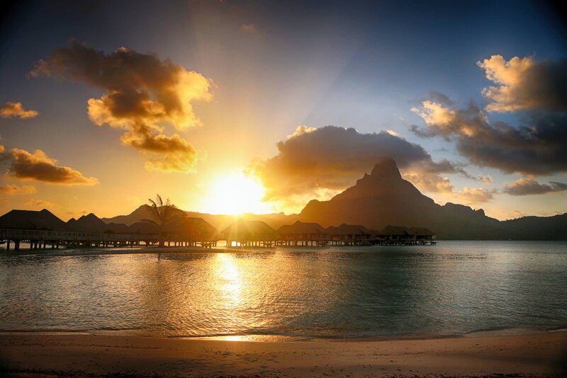 Overwater Bungalows at Sunset — Gold, Serene