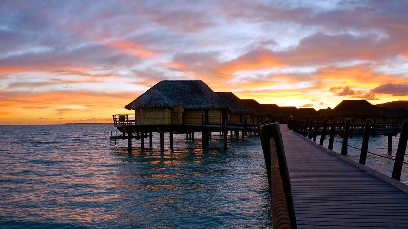 Overwater Bungalows at Sunset — Orange, Serene, Photograph, Pier, Ocean, Sky