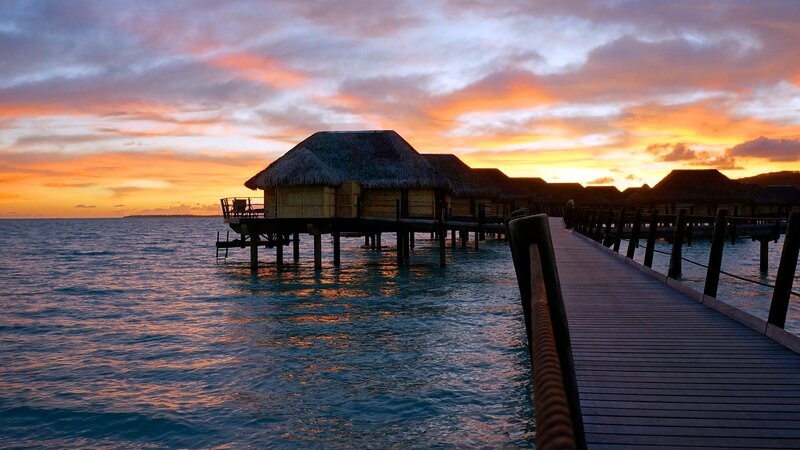 Overwater Bungalows at Sunset — Orange, Serene, Photograph, Pier, Ocean