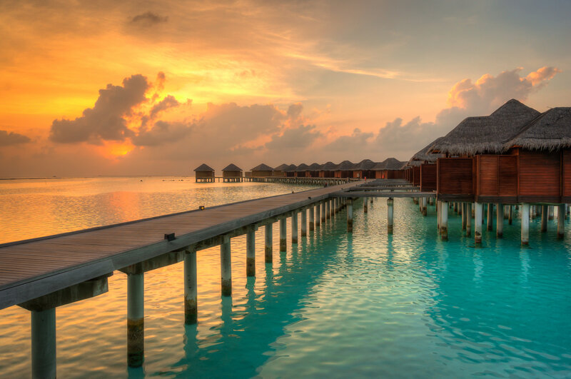 Overwater Bungalows at Sunset — Orange, Serene, Photograph, Pier