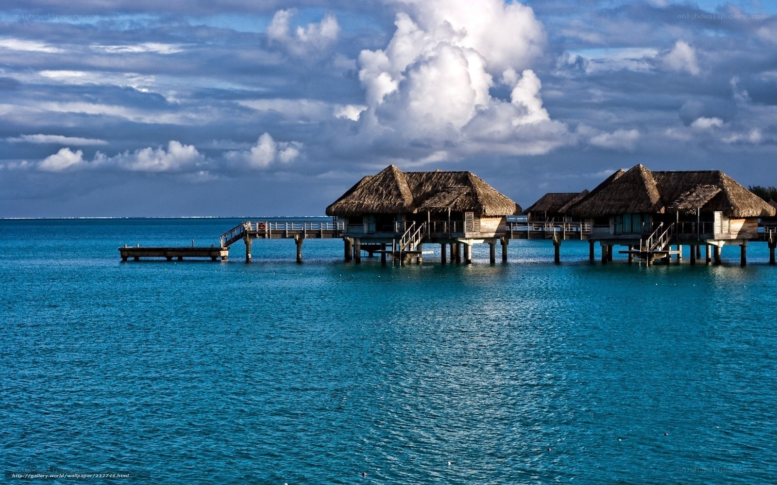 Overwater bungalows at sunset