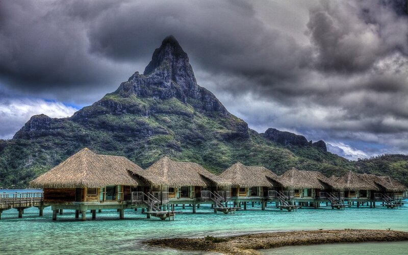 Overwater Bungalows — Blue, Dramatic, Photograph, Mountain, Thatched Roofs