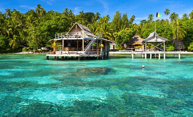 Overwater Bungalows — Blue, Serene, Afternoon, Photograph, Palm Trees, Ocean, Flag