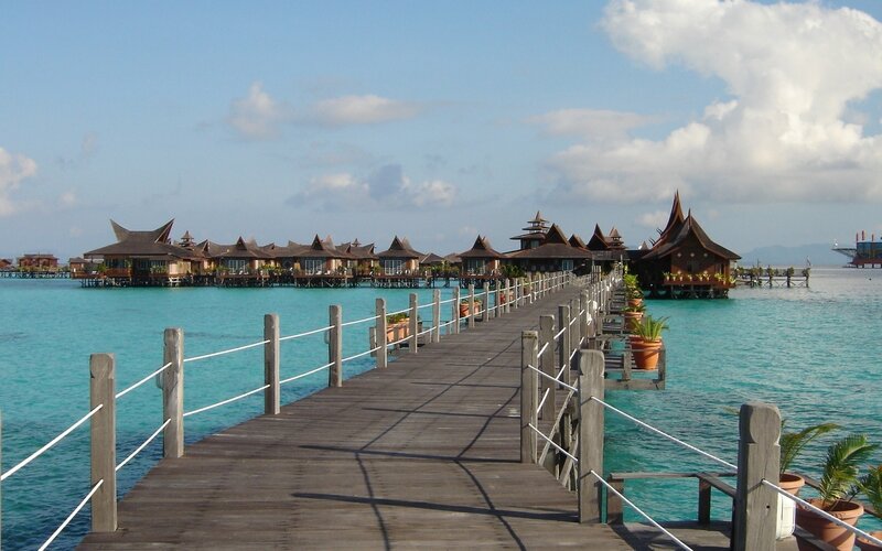 Overwater Bungalows — Blue, Serene, Afternoon, Photograph, Pier, Ocean, Plants, Sky, Brown, White