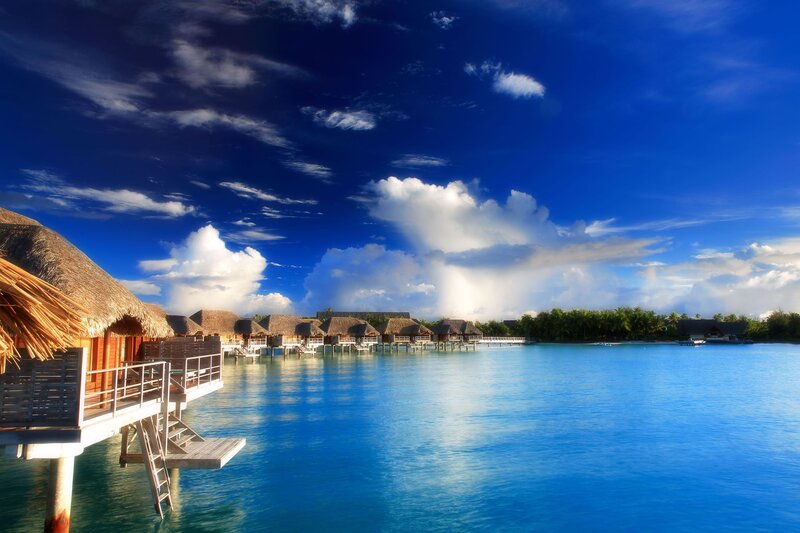 Overwater Bungalows — Blue, Serene, Afternoon, Photograph, Thatched Roofs, Ocean, Clouds
