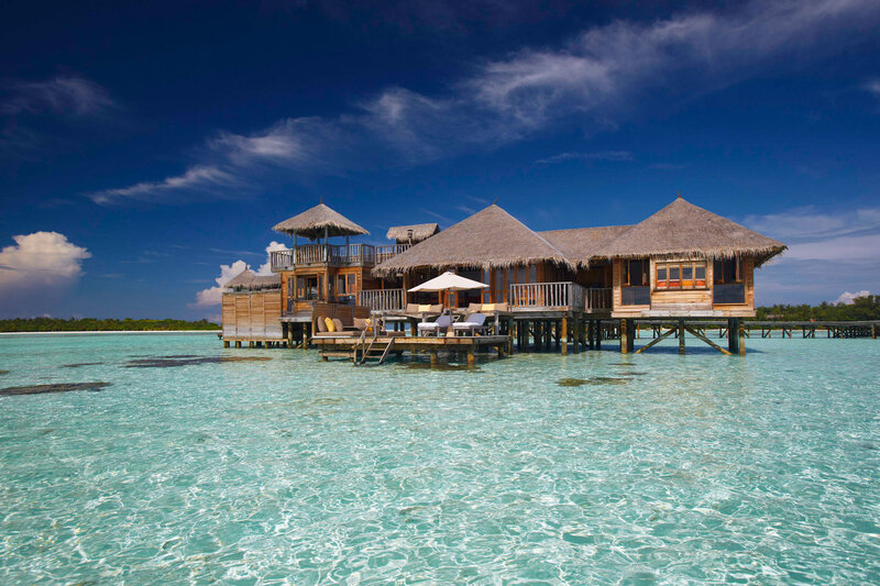 Overwater Bungalows — Blue, Serene, Afternoon, Photograph, Thatched Roofs, Ocean, Sky, Deck