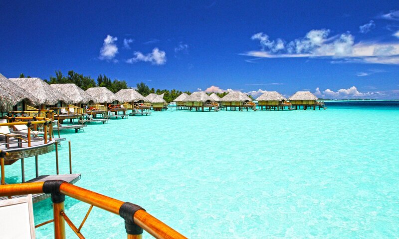 Overwater Bungalows — Blue, Serene, Afternoon, Photograph, Thatched Roofs, Ocean, Sky