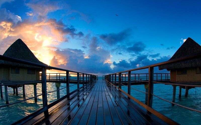 Overwater Bungalows — Blue, Serene, Sunset, Photograph, Pier, Thatched Roofs
